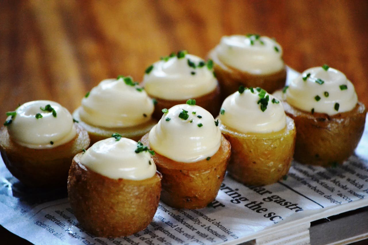 Delicious roasted potato bites topped with creamy sour cream and chives.